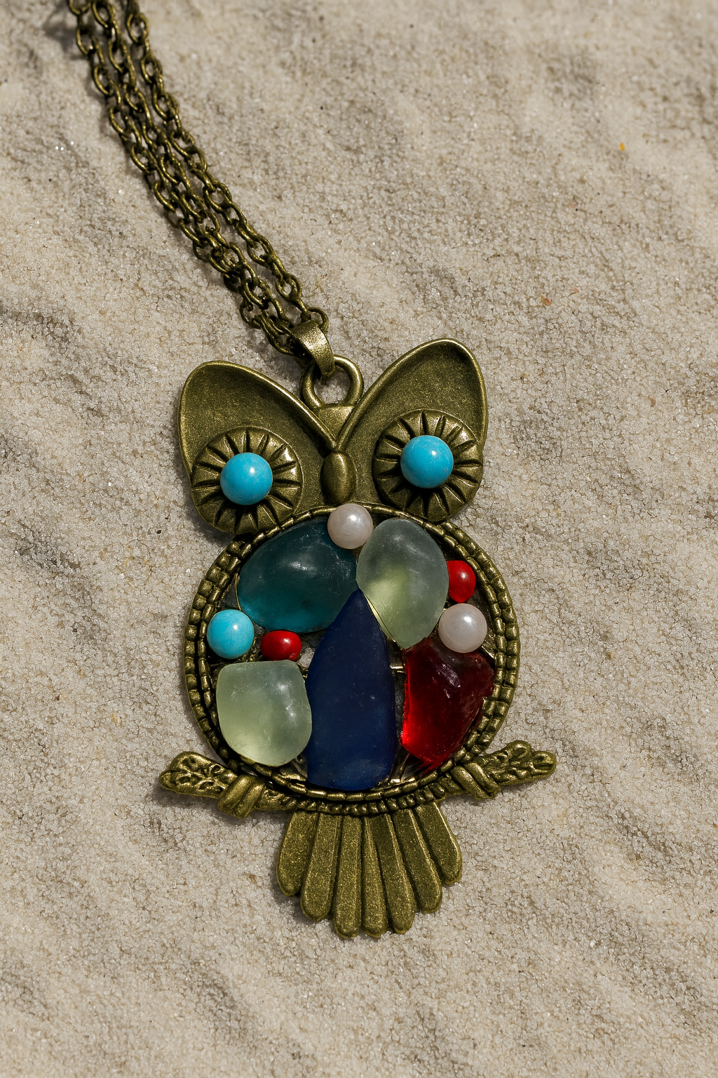 White mist, turquoise, blue & red sea glass on an Owl bezel Pendant