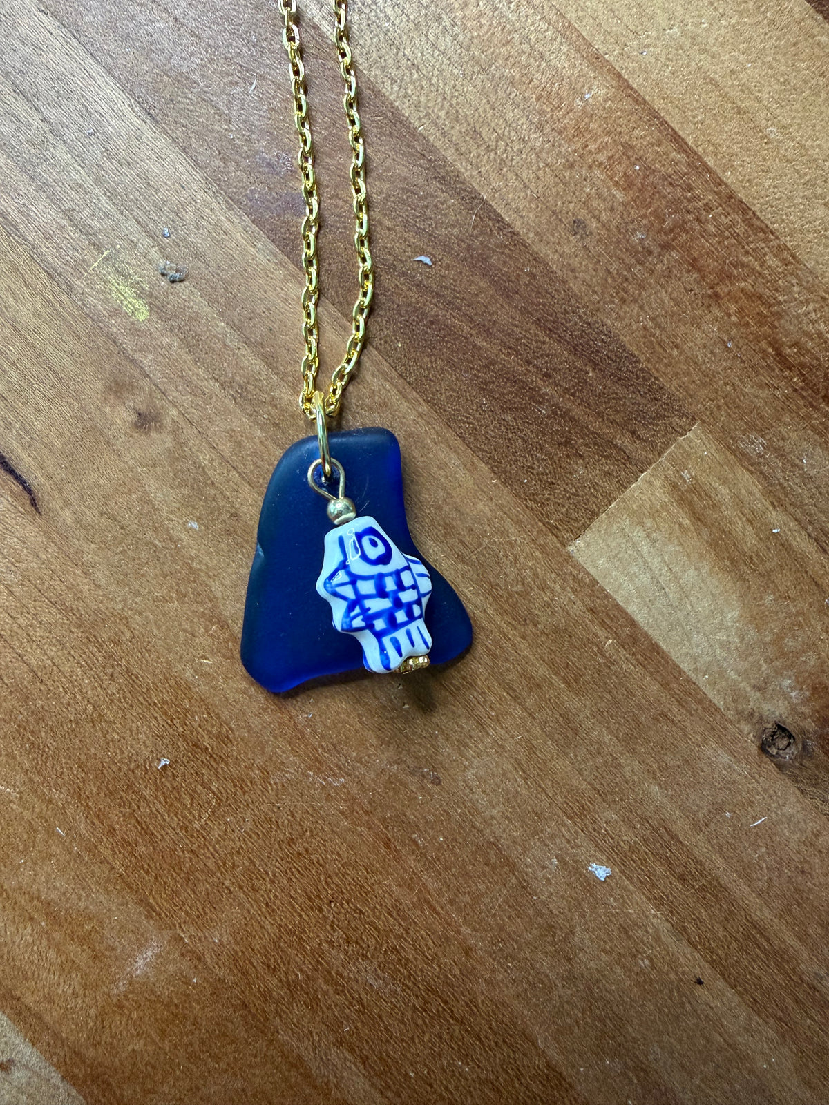 Ocean's Whisper Necklace | Cobalt Blue Sea Glass and Ceramic Fish Pendant