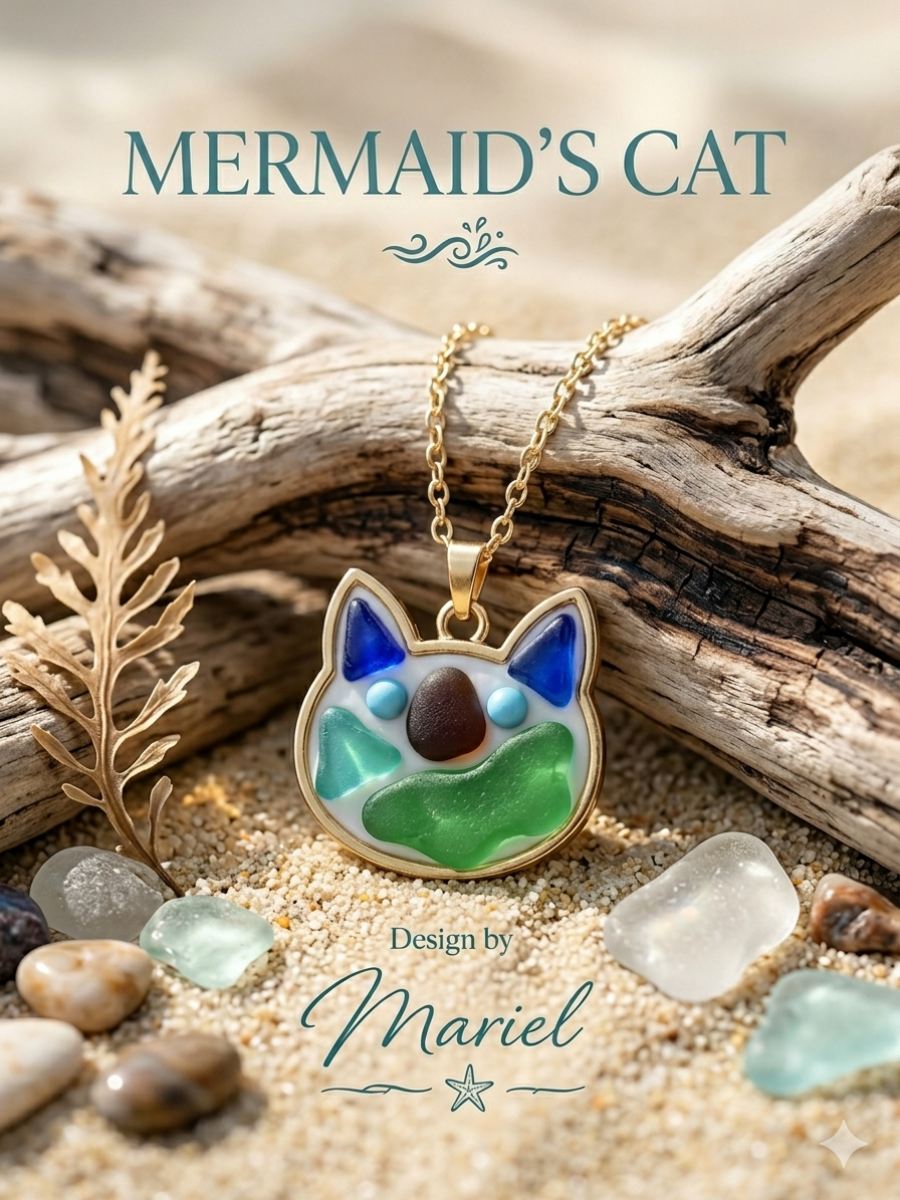 Cat-shaped pendant necklace on a natural setting with driftwood and stones