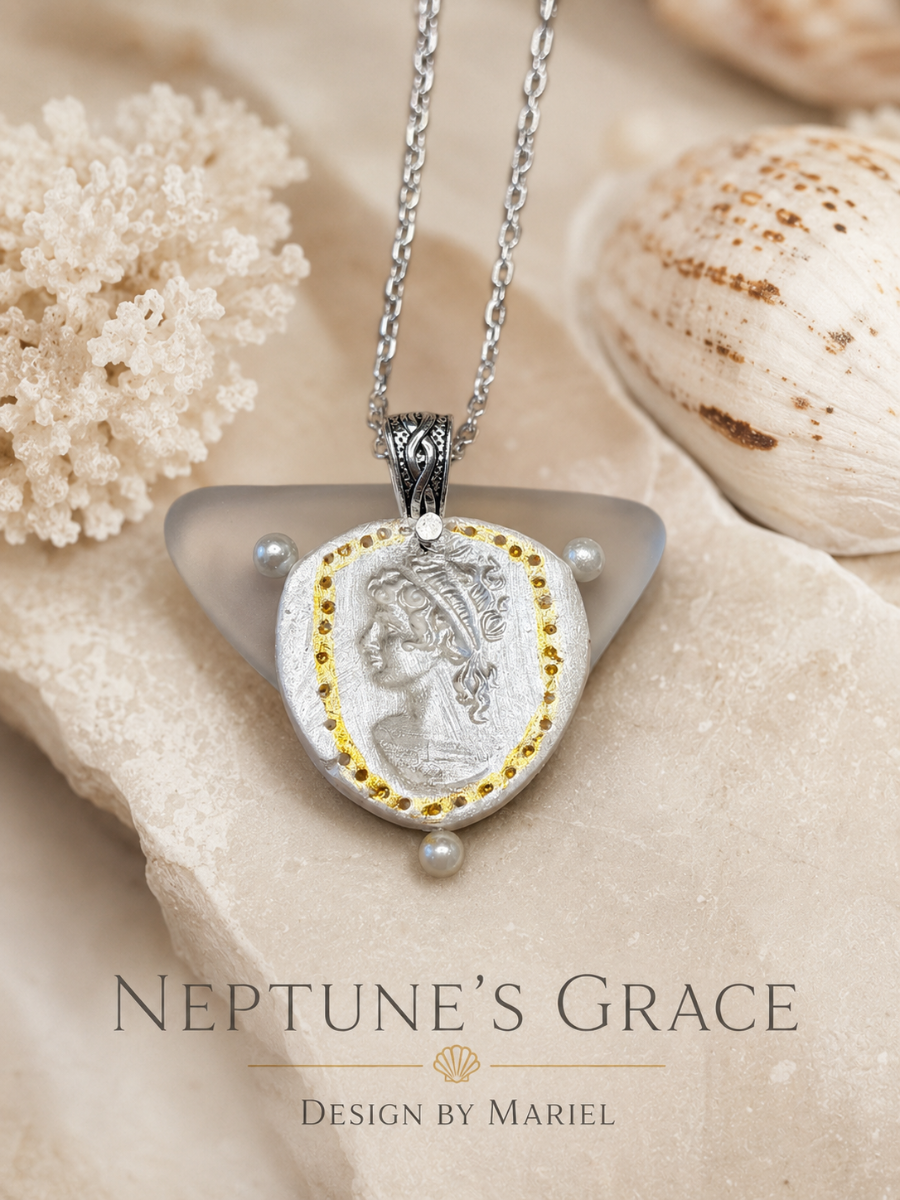 Neptune's Grace necklace with shell pendant on a textured surface